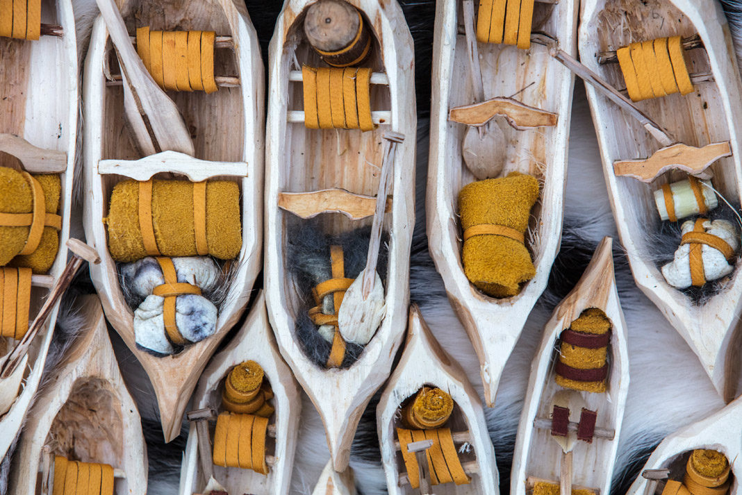 Mike Ranta adds tiny paddles, thwarts, seats, and voyageur sacks out of fur and hide