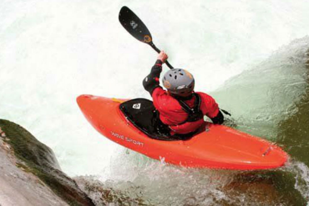 Person paddling the WaveSport Habitat creek boat in whitewater