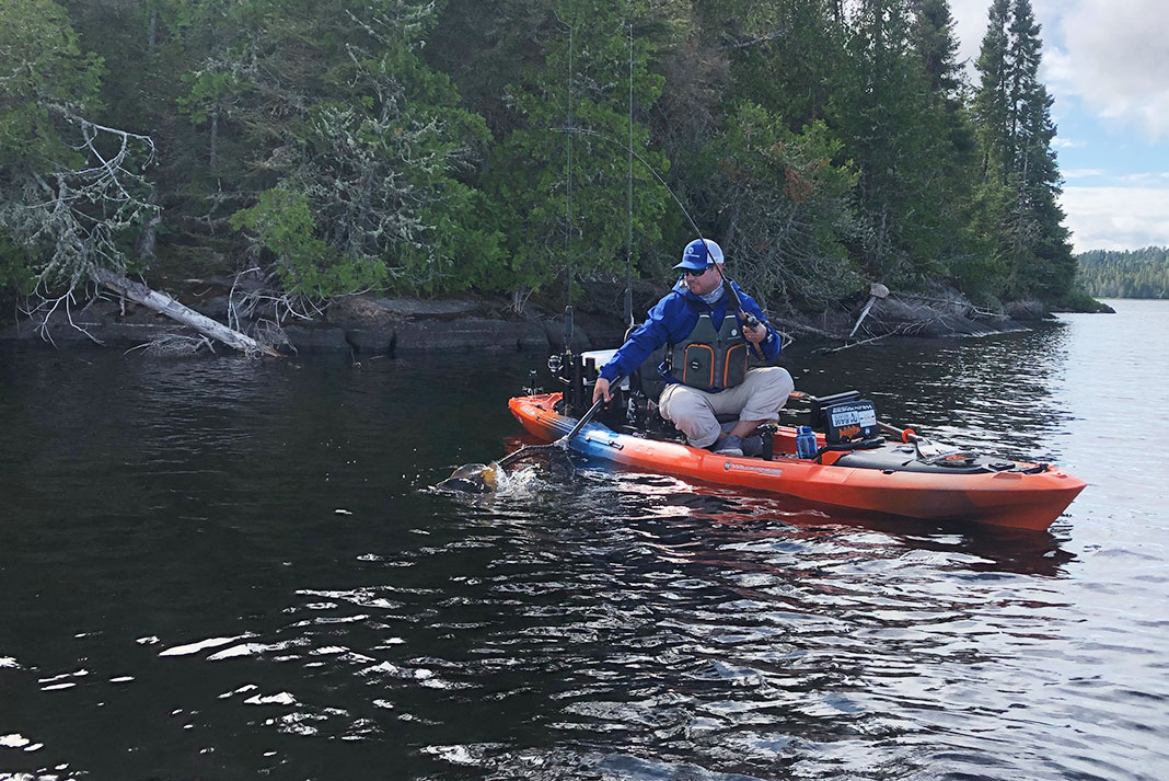 A kayak angler fishes a smallmouth bass hot spot