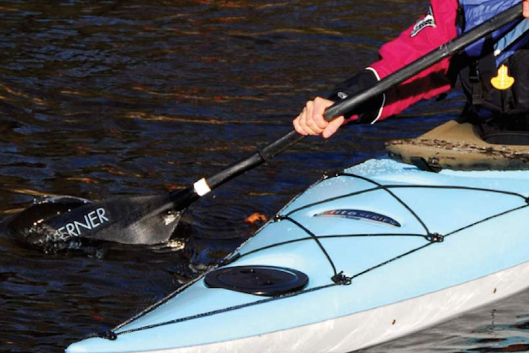 Woman paddling the Pelican Strait 120 kayak
