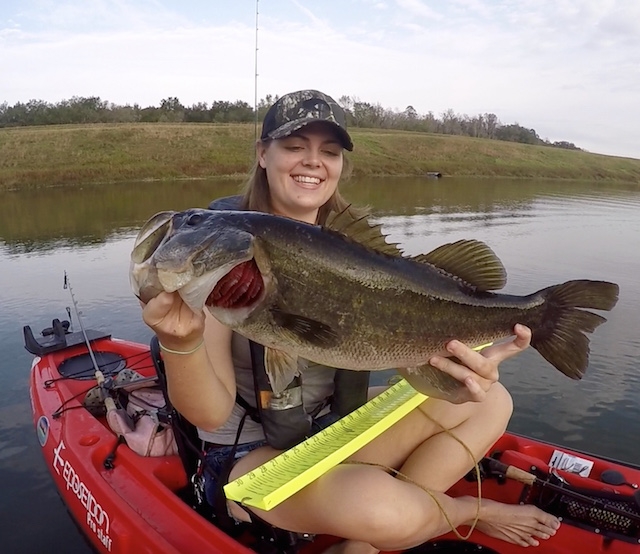 Sydney Sewell holds up a giant largemouth she caught on a soft plastic frog. Photos: Sydney Sewell