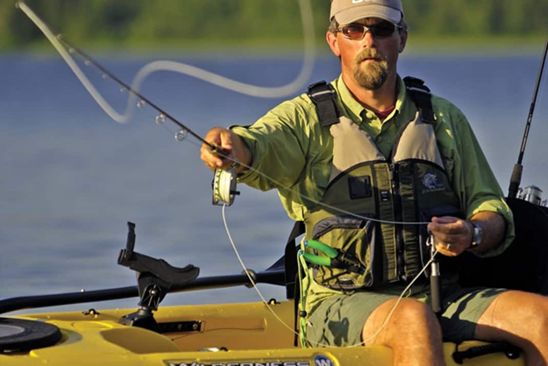 kayak angler fly fishes, one of the ways to catch fish from a kayak