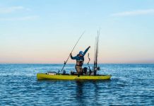 kayak angler prepares to fish for California yellowtail by trolling with live bait