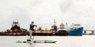 Man paddles the Kaku Voodoo hybrid paddlecraft like a SUP