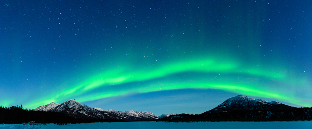 The Northern Lights over the mountains