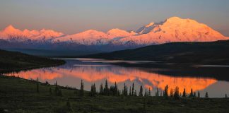Sunset over the mountains and water of Denali National Park