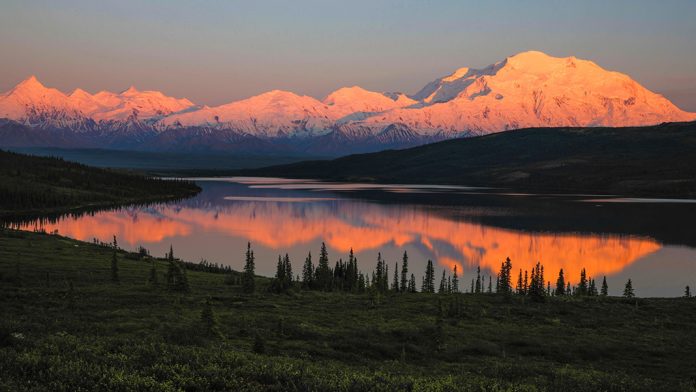 Sunset over the mountains and water of Denali National Park