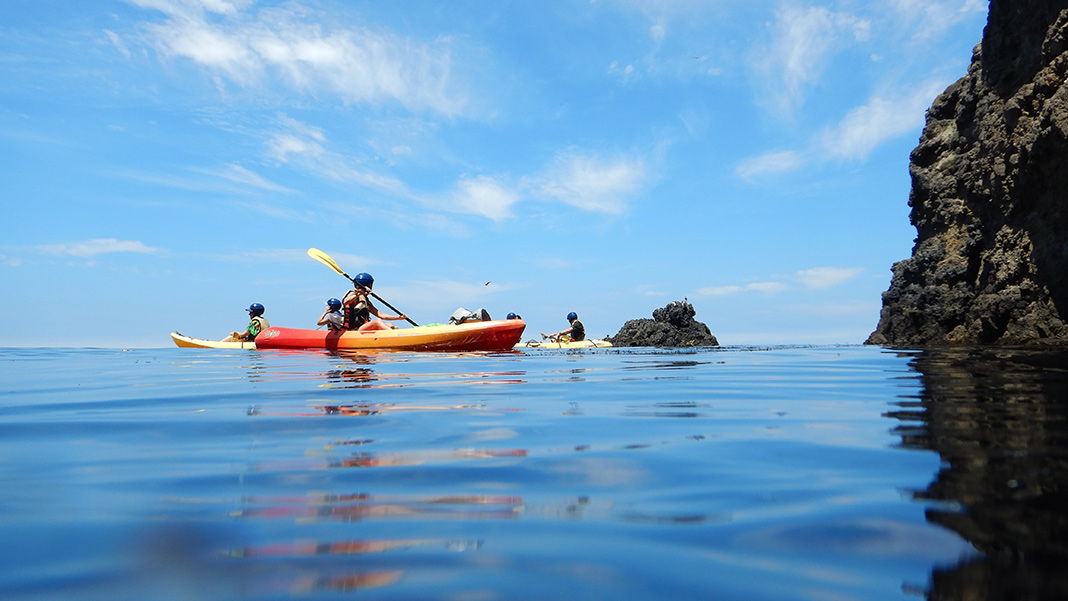 Kayaking on calm, blue waters