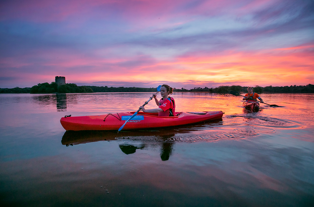 Kayakers on Lough Oughter during a sunset