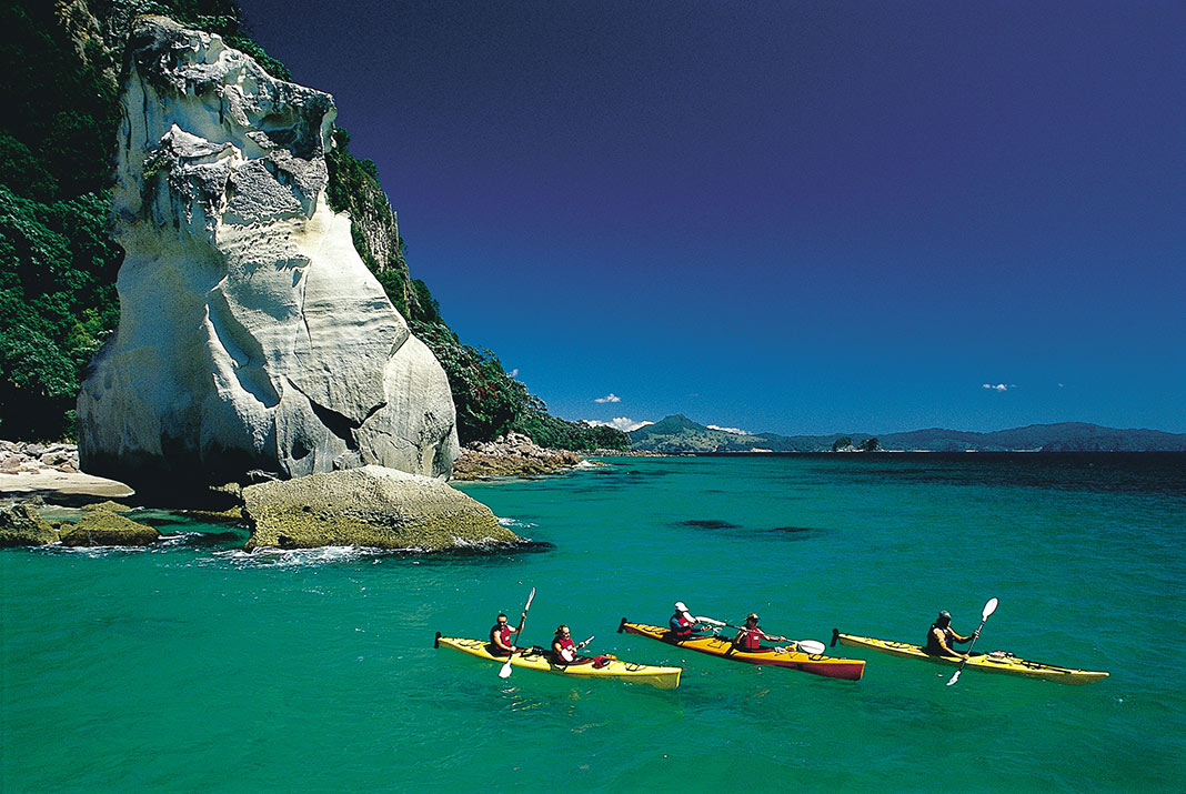 Kayakers paddling on turquoise waters