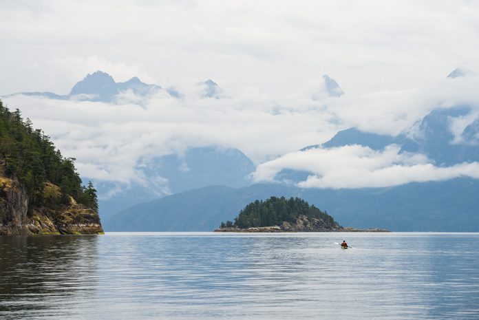 Kayaking on the sunshine coast, an island in the distance