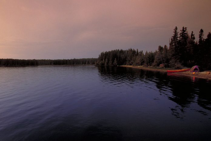 Camping on the shore of a dark lake