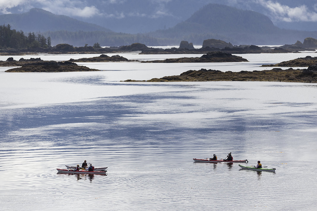 Kayakers on the clear waters of Vancouver Island