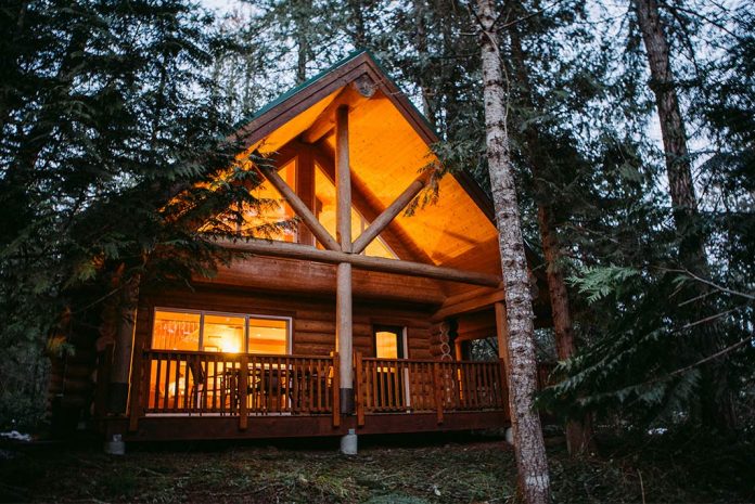 A lit cabin in the woods of Vancouver Island