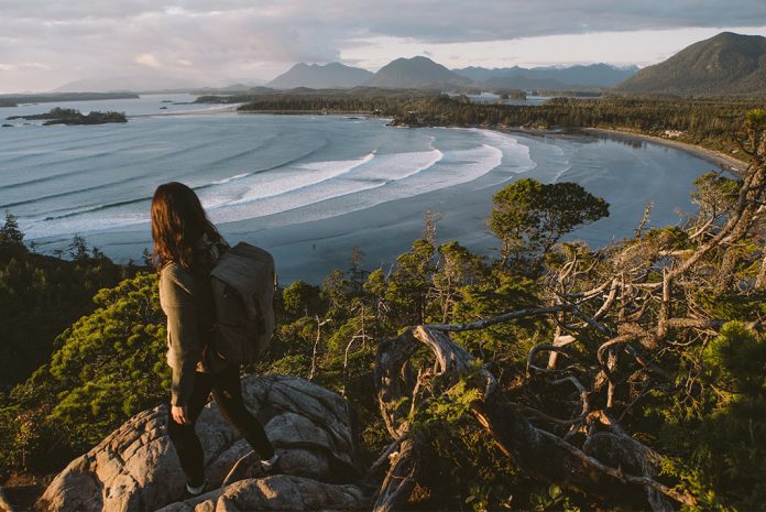 A hiker overlooking the ocean from up high