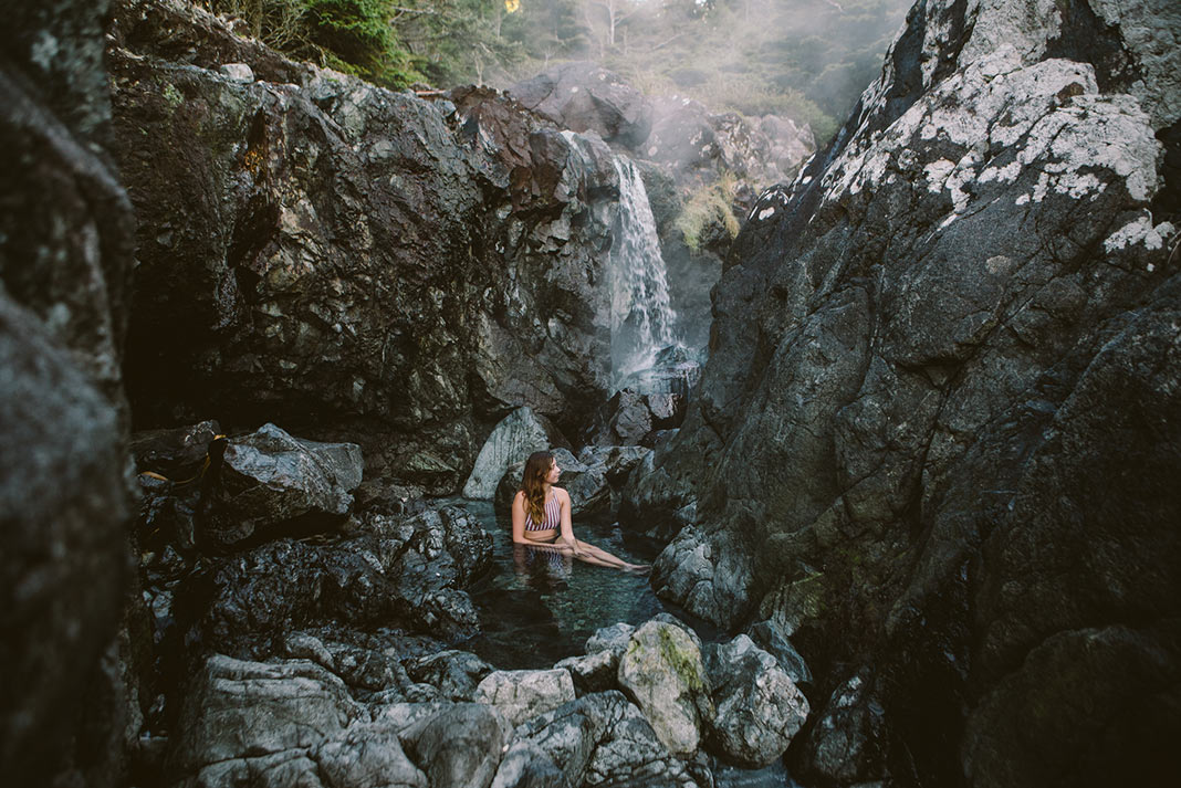 A woman soaks in the Tofino hot springs