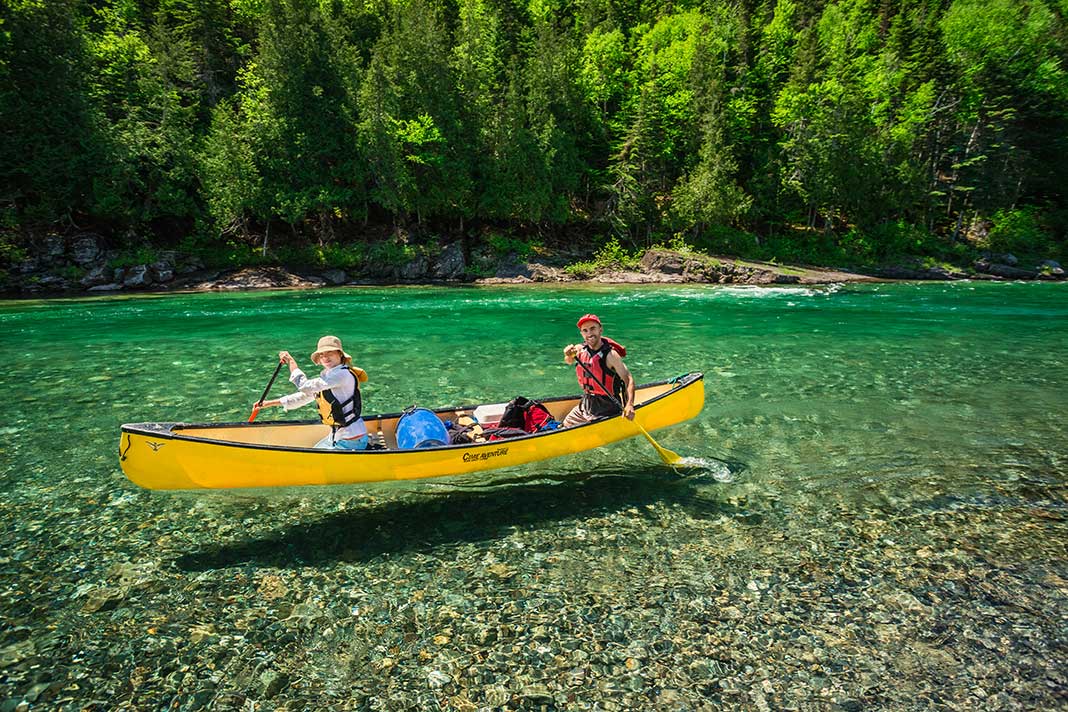 Canoeing on crystal clear water in Quebec
