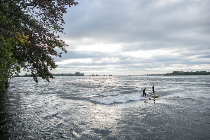 Two surfers on the St. Lawrence, one of many things to do in Montreal