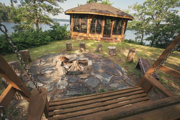 Photo of gazebo and firepit on the edge of a lake