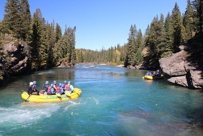 Two rafts floating on river