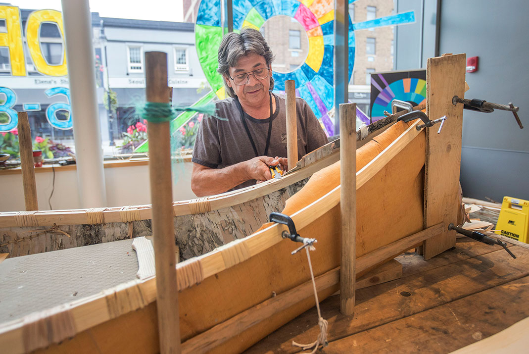 Chuck Commanada's birchbark canoes are crafted by hand, using traditional methods he learned from his grandparents. | Photo: Bob Tymczyszyn