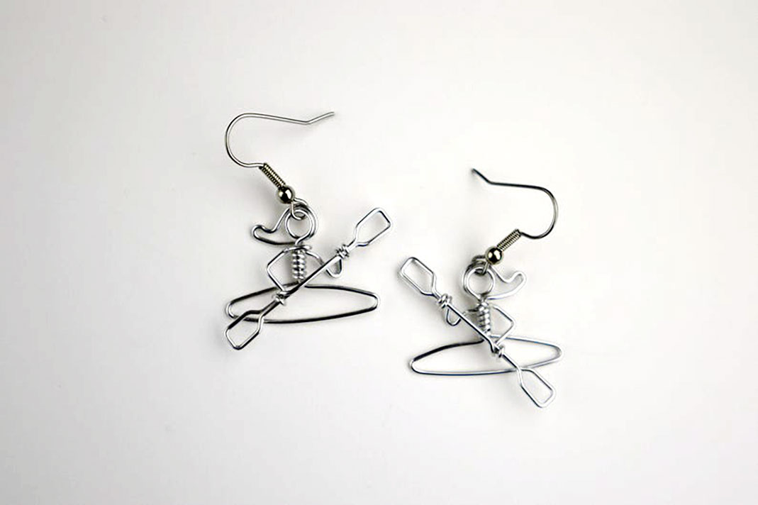 Earrings made of wire in shape of kayakers.
