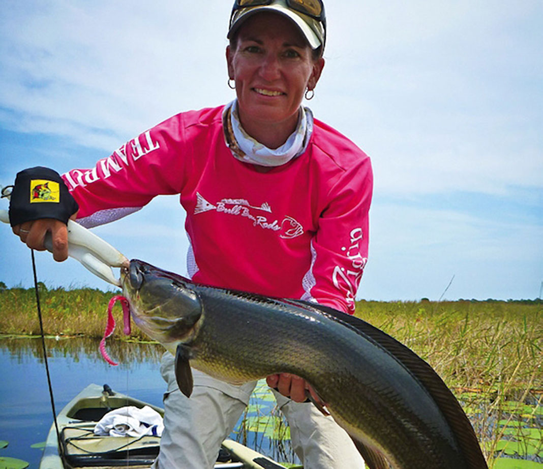 Captain Dee Kaminski holds up a big bowfin caught down in Florida