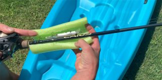 person adds a pool noodle lure guard to a rod and lure in a fishing hack