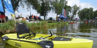Hobie Mirage Compass kayak sits at the river's edge