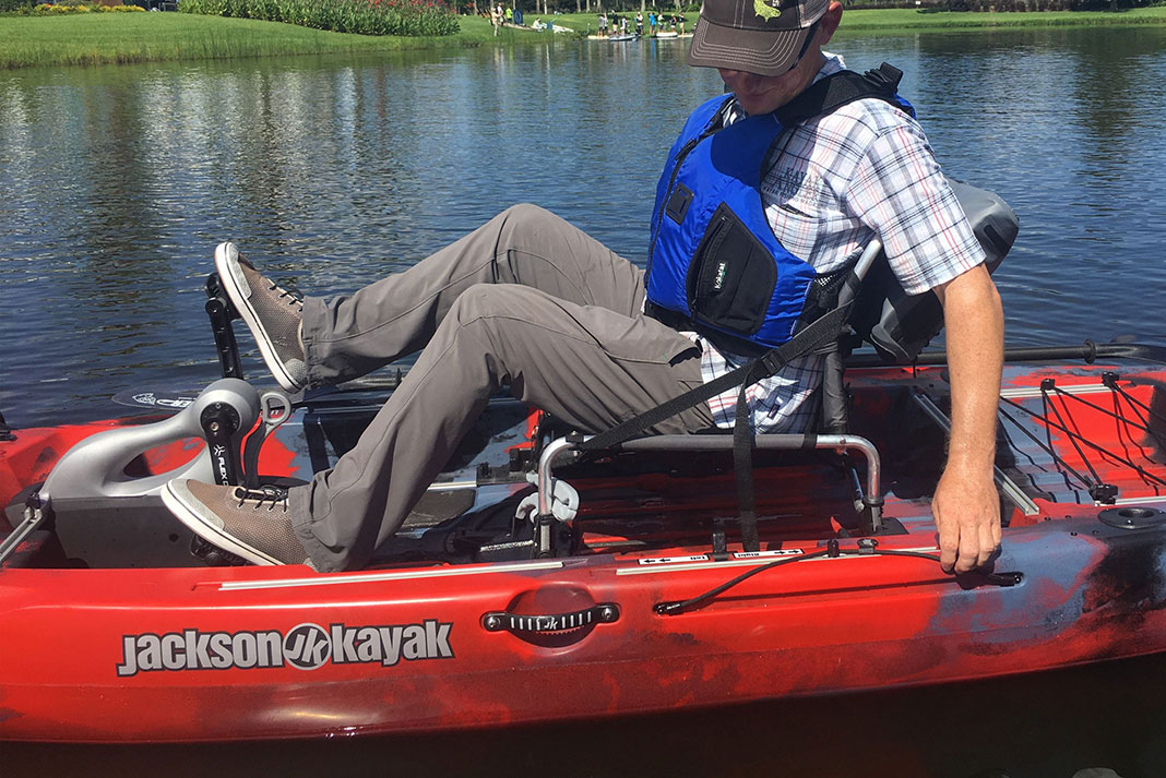 man pedals the Jackson Coosa FD kayak
