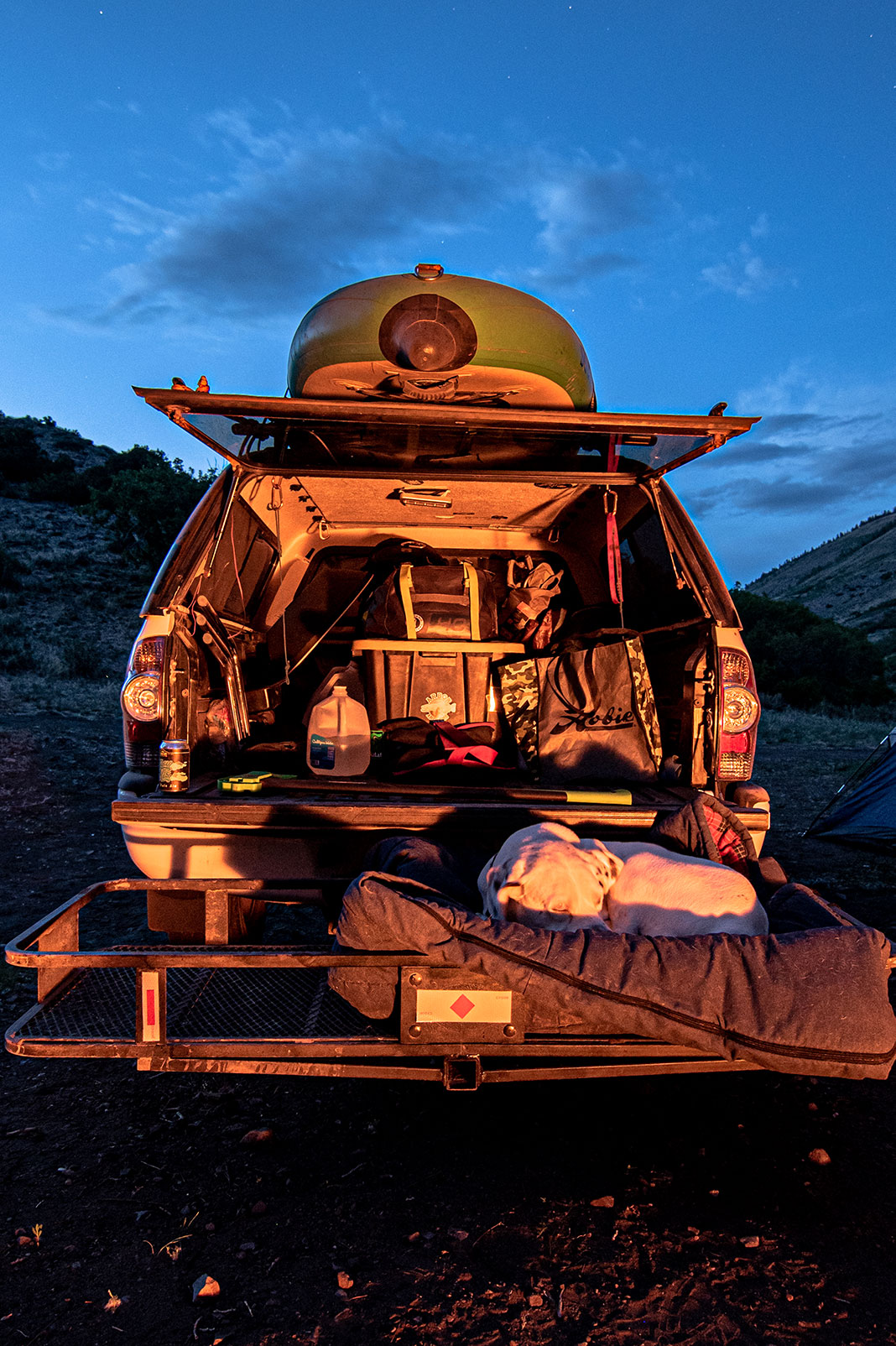 Camping out of the back of a van while kayak fishing in Colorado