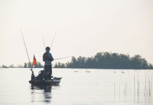man kayak fishing with his new Father's Day gifts