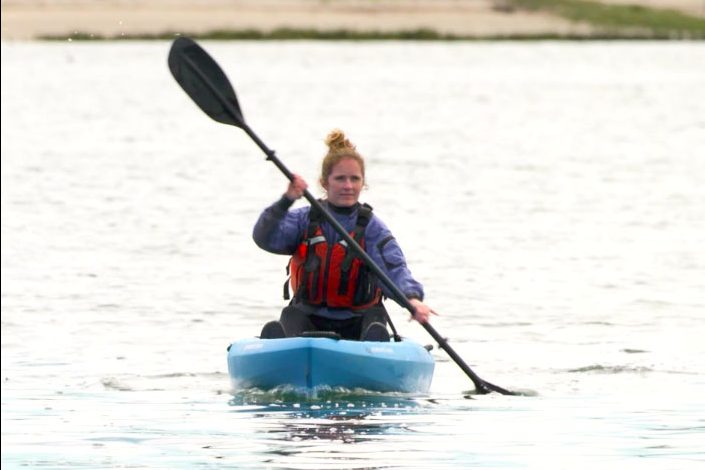 Kate Kuthe uses her core muscles to paddle in a straight line.