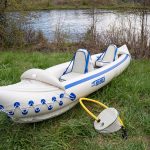 The bow and stern spray decks inflate to provide added buoyancy and help shed waves. They’re lashed onto the deck with ropes that double as safety grab lines and a place to tie gear. There is also a plastic-molded attachment for a bowline. | Photo: Colin Field