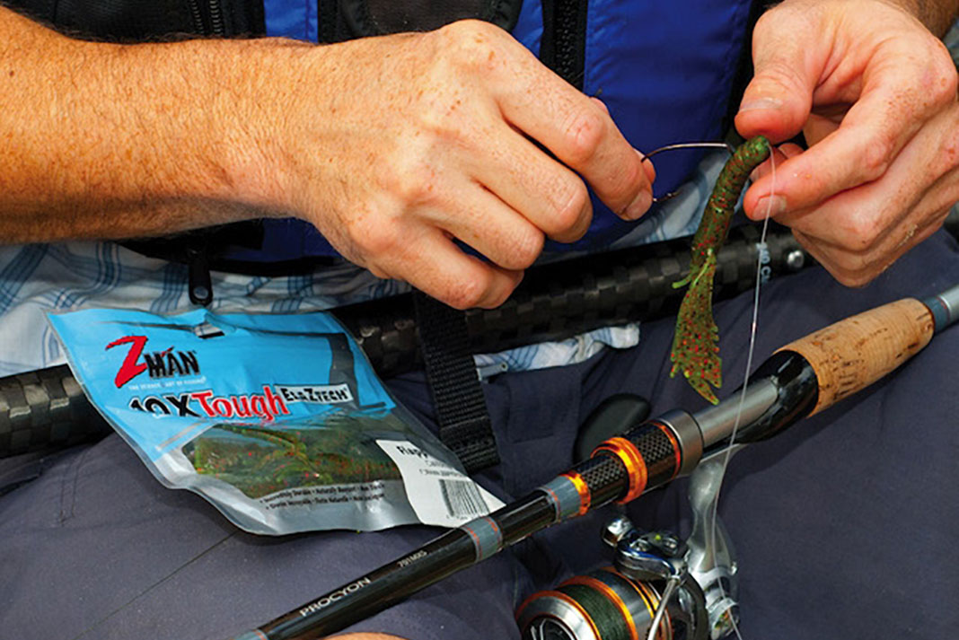 close-up of person rigging up biodegradable fishing lures from Z-Man