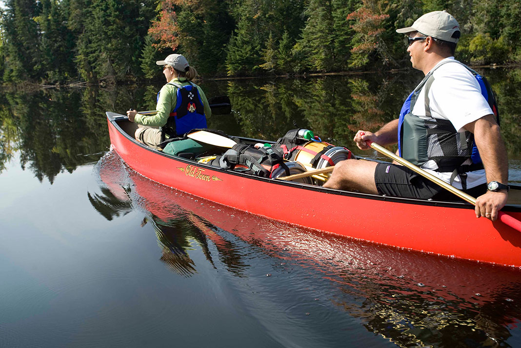 man and woman embark on a mistake-free wilderness canoe trip