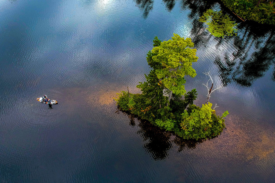 overhead shot of a kayak angler on a rippled lake