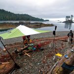 Tarp Shelter Tips For Canoe And Kayak Camping kayakers setup a tarp shelter while on a camping trip