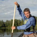 Get Swinging With The Canoe Cross-Forward Stroke man in a canoe demonstrates the cross-forward stroke