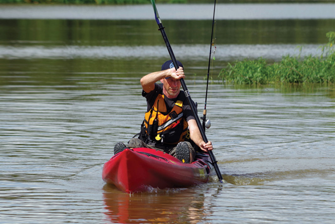 man in kayak demonstrates the bow rudder turning technique
