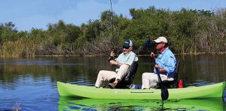 two senior men fish out of a NuCanoe Frontier 12 hybrid fishing kayak