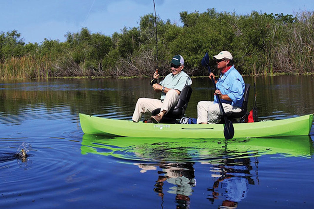 two senior men fish out of a NuCanoe Frontier 12 hybrid fishing kayak