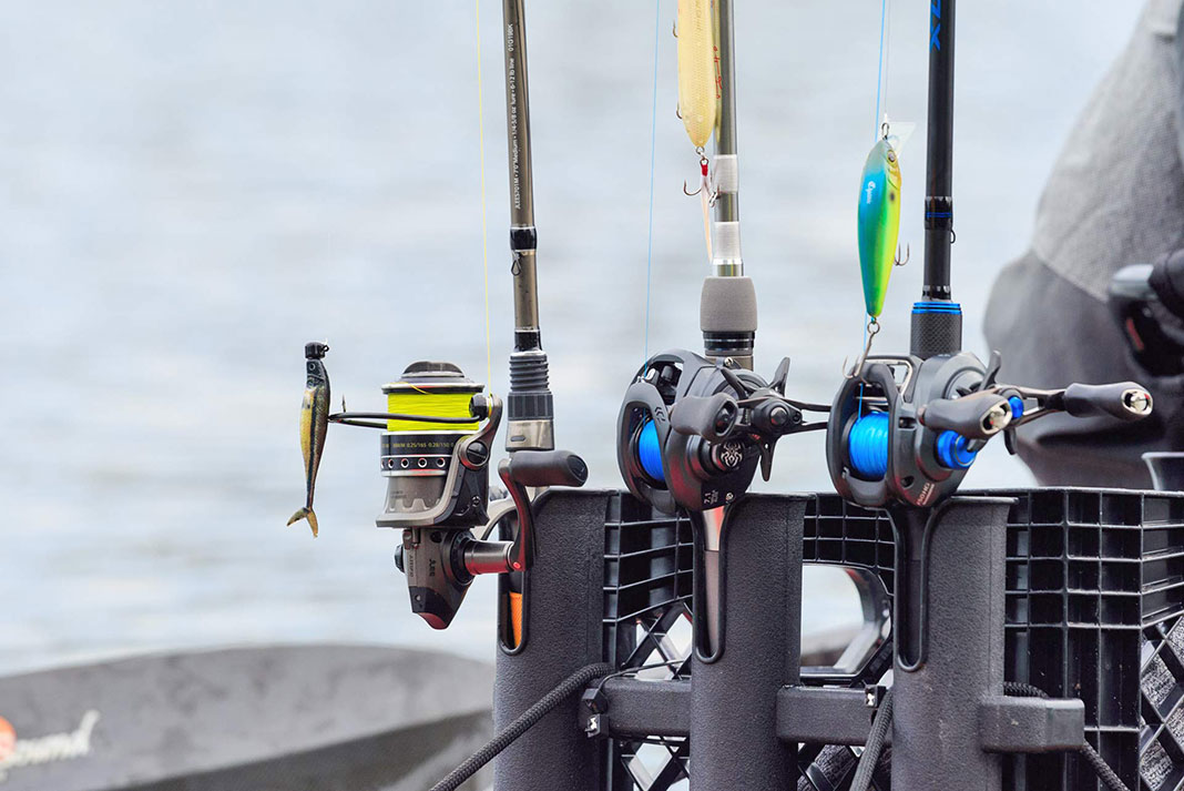 three fishing rod and reel combos all lined up and ready for action.