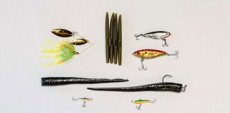 a selection of finesse fishing lures laid out on a white background