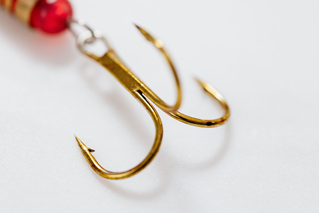 detail shot of a gold treble fishing hook