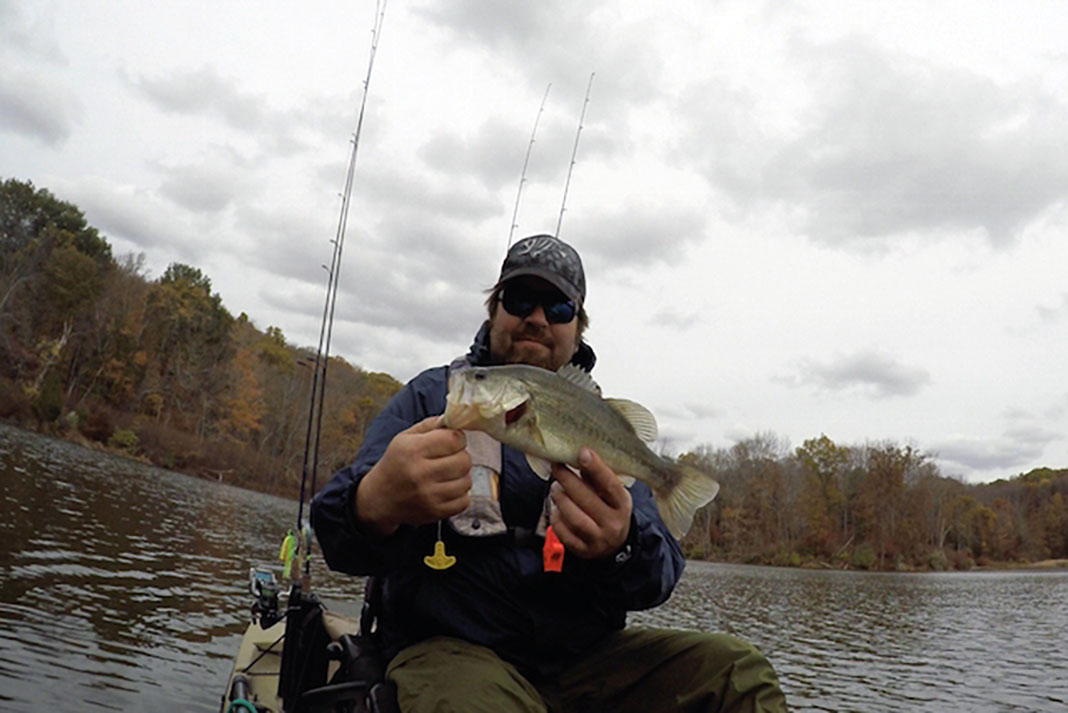 angler holds up largemouth bass caught in fall at Lake Wallenpaupack