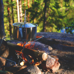 breakfast cooking over a campfire