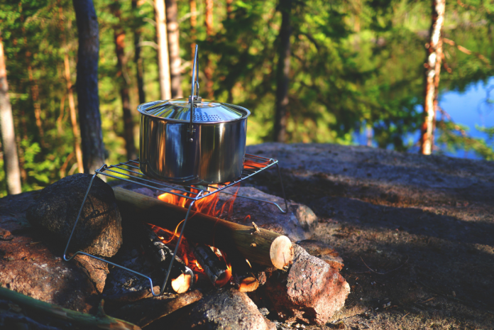 breakfast cooking over a campfire