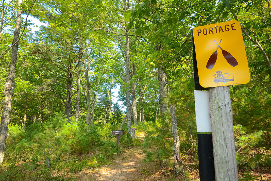 a portage sign in the forest