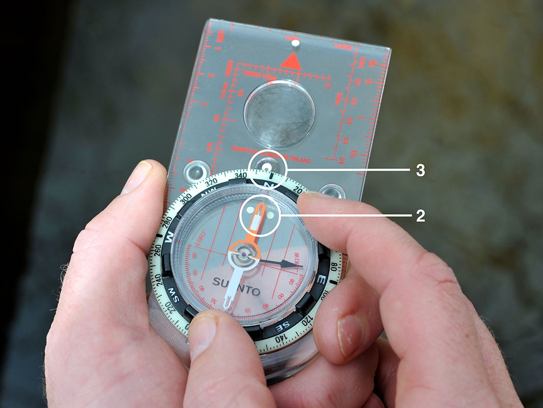 how to take a bearing in the field with a compass